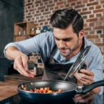 depositphotos_162010172-stock-photo-young-man-cooking